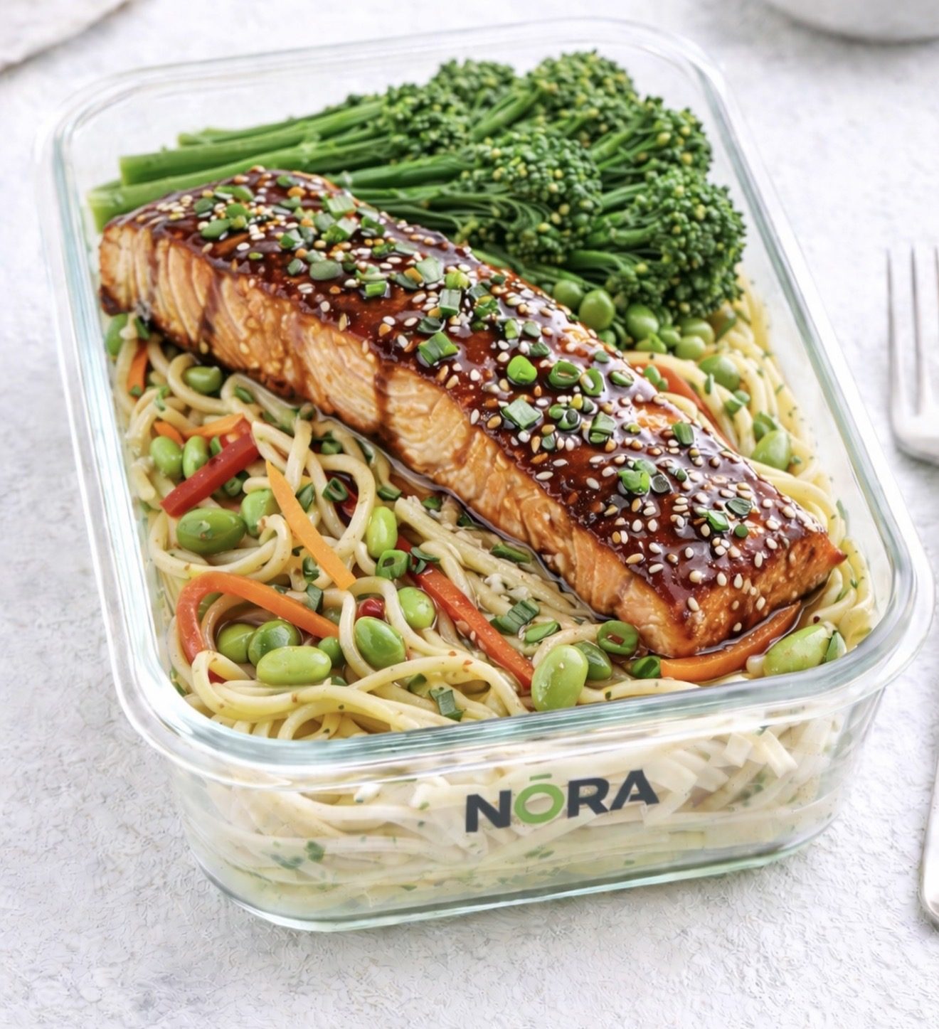 NŌRA Teriyaki Salmon meal prep with soba noodles, broccoli and edamame